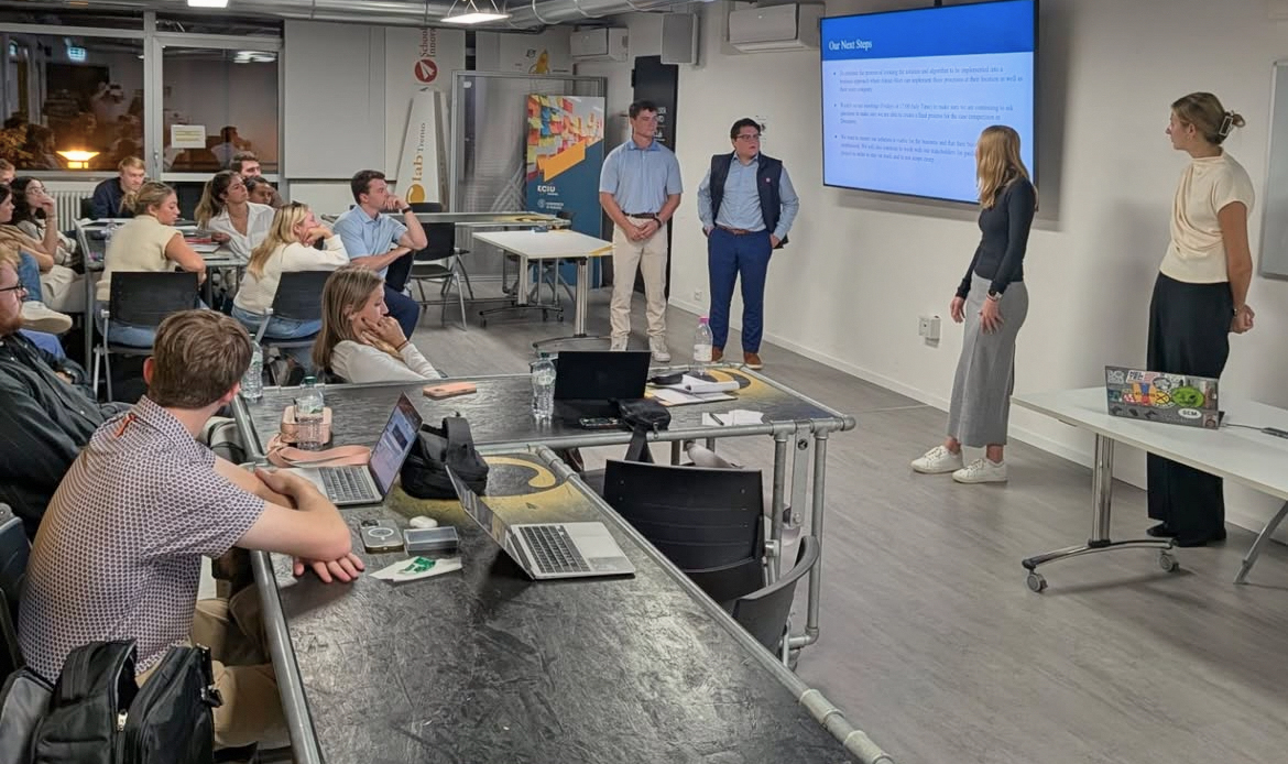 Four students presentation in classroom