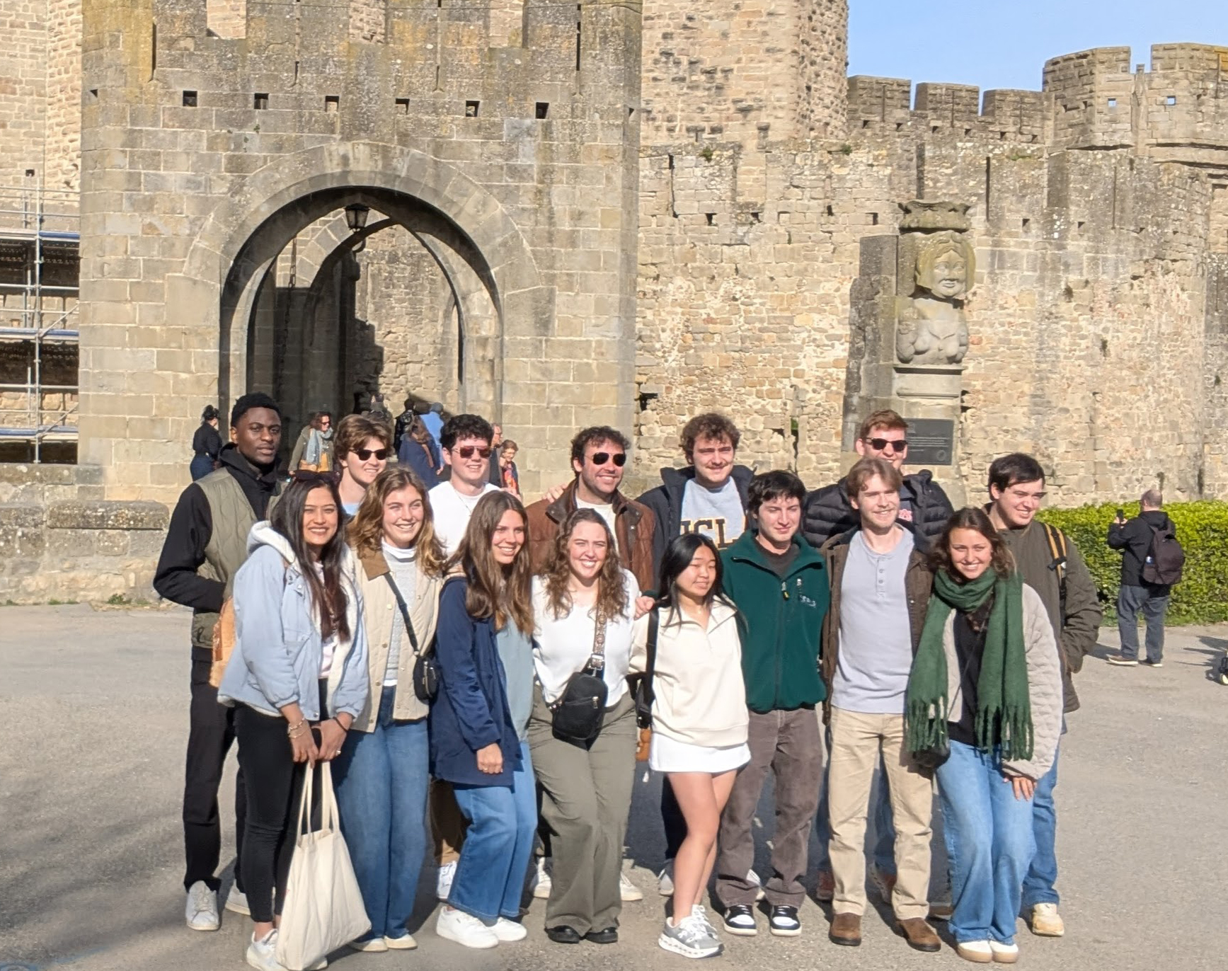 Students standing in front of castle