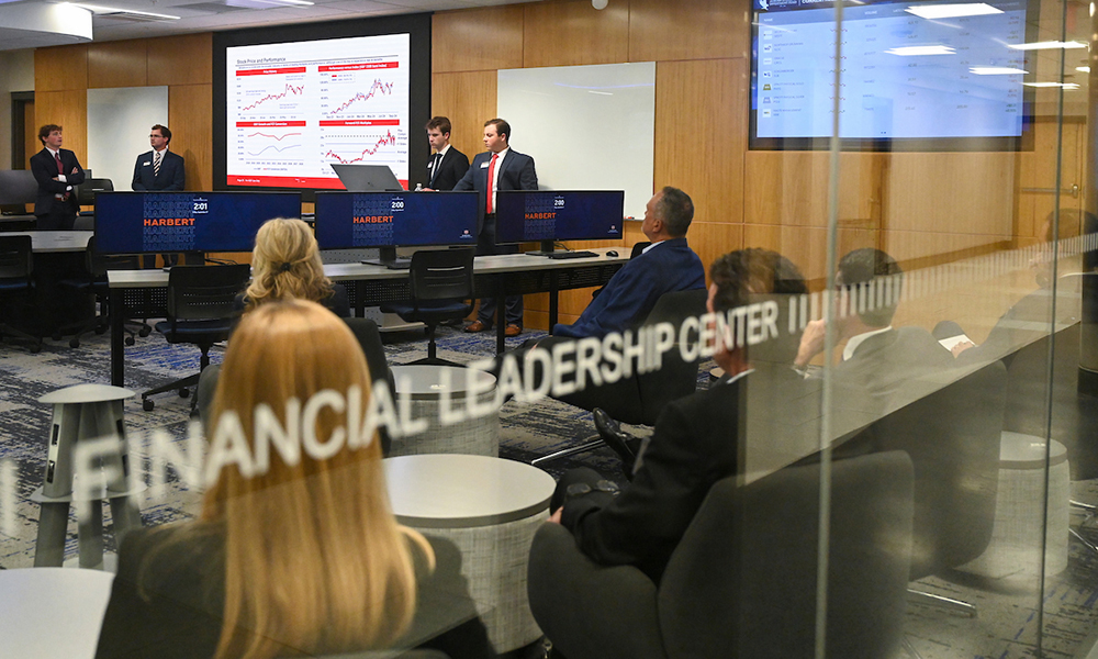 Students making presentation in financial lab