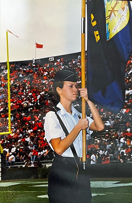 Woman cadet holding flag