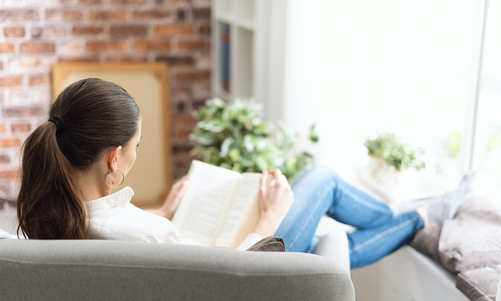 Woman reading on couch