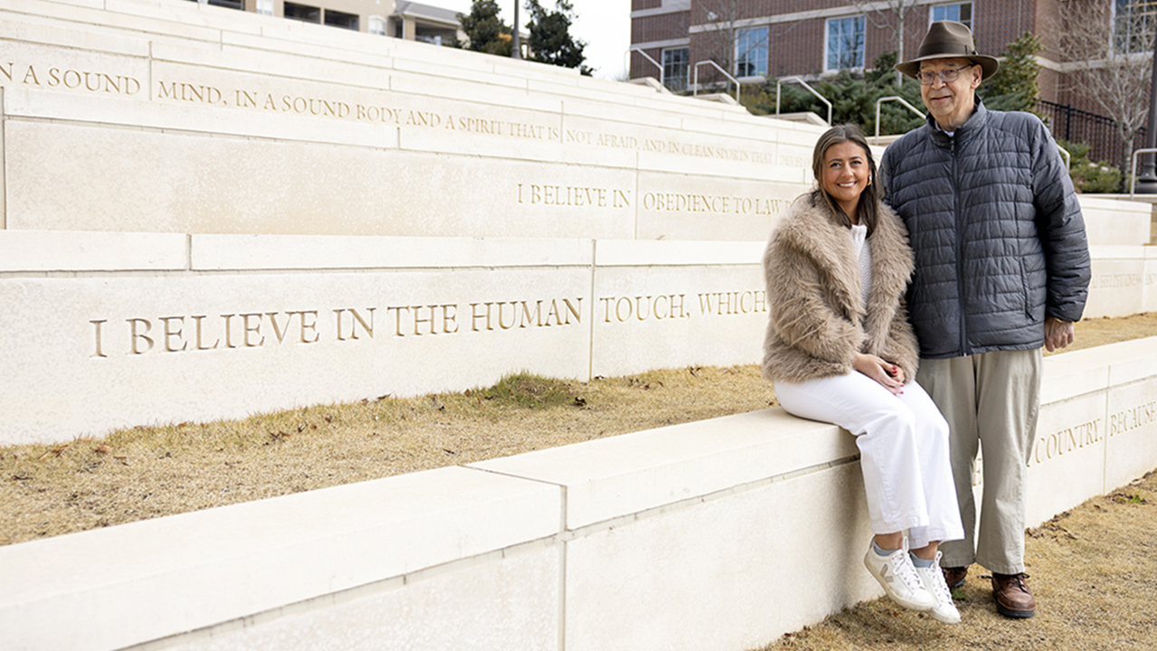 2 people at Auburn Creed steps