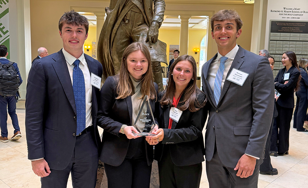 4 students holding plaques