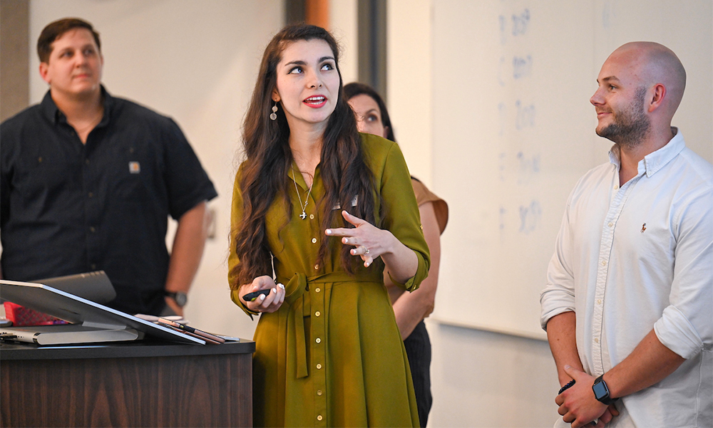 3 people giving presentation