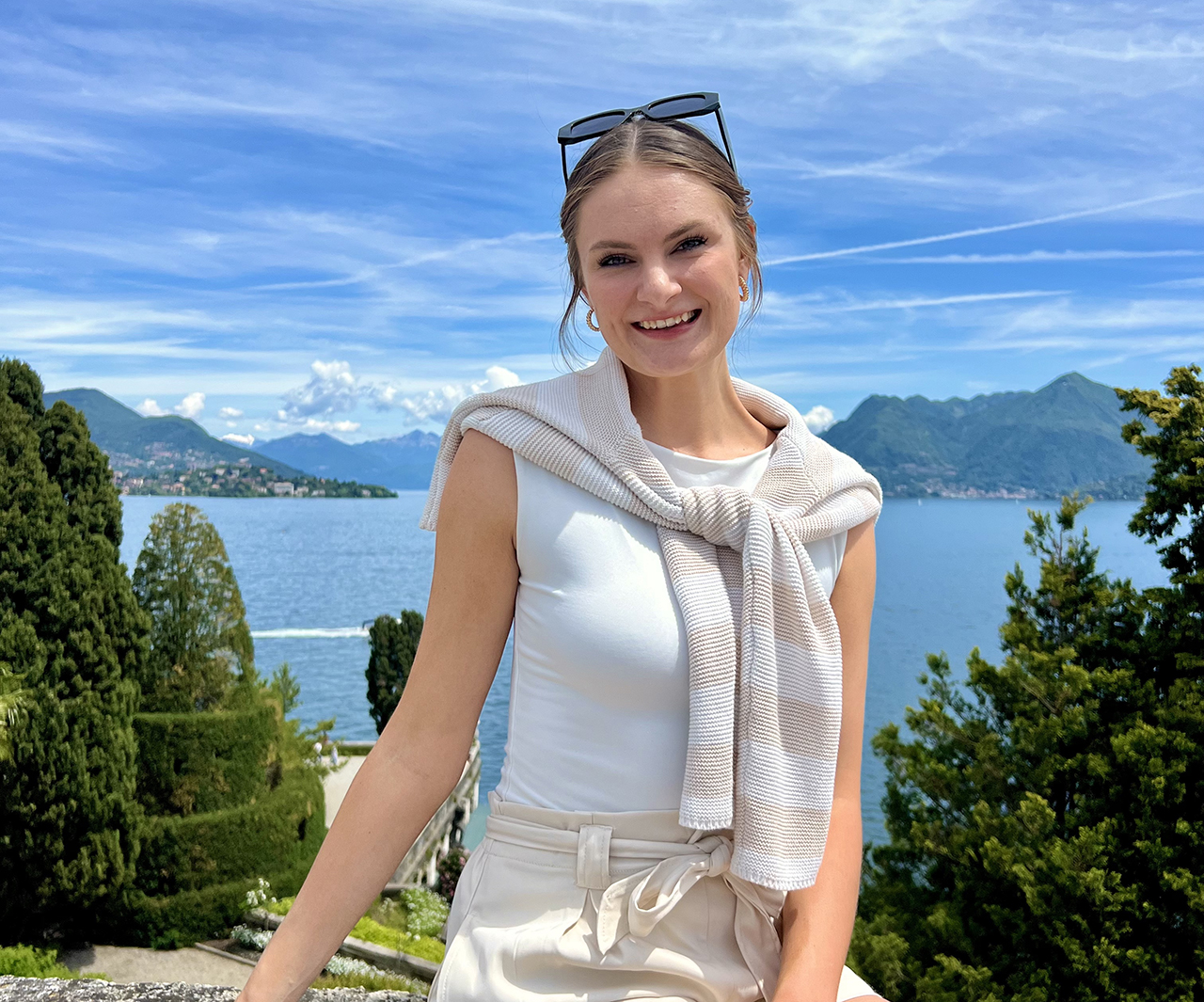 Abby Stansell sitting near Italian lake