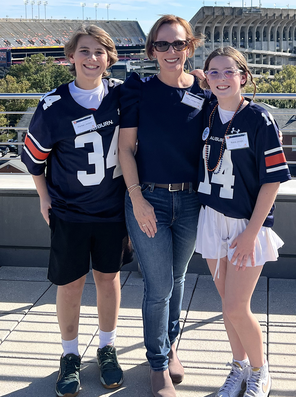 Amy Jones alumna and donor Alumna Amy Jones and 2 kids stading on HHH rooftop