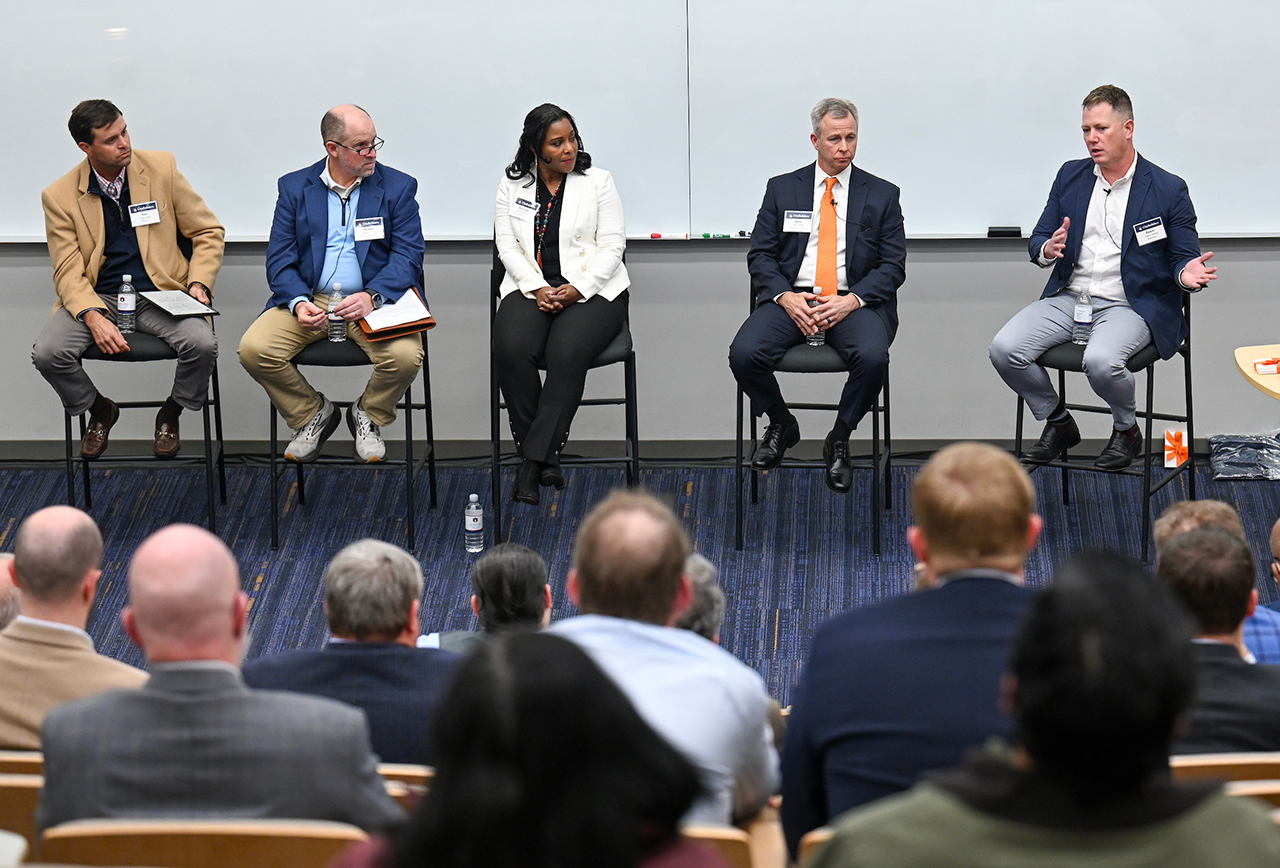 Panel of experts sitting in front of audience