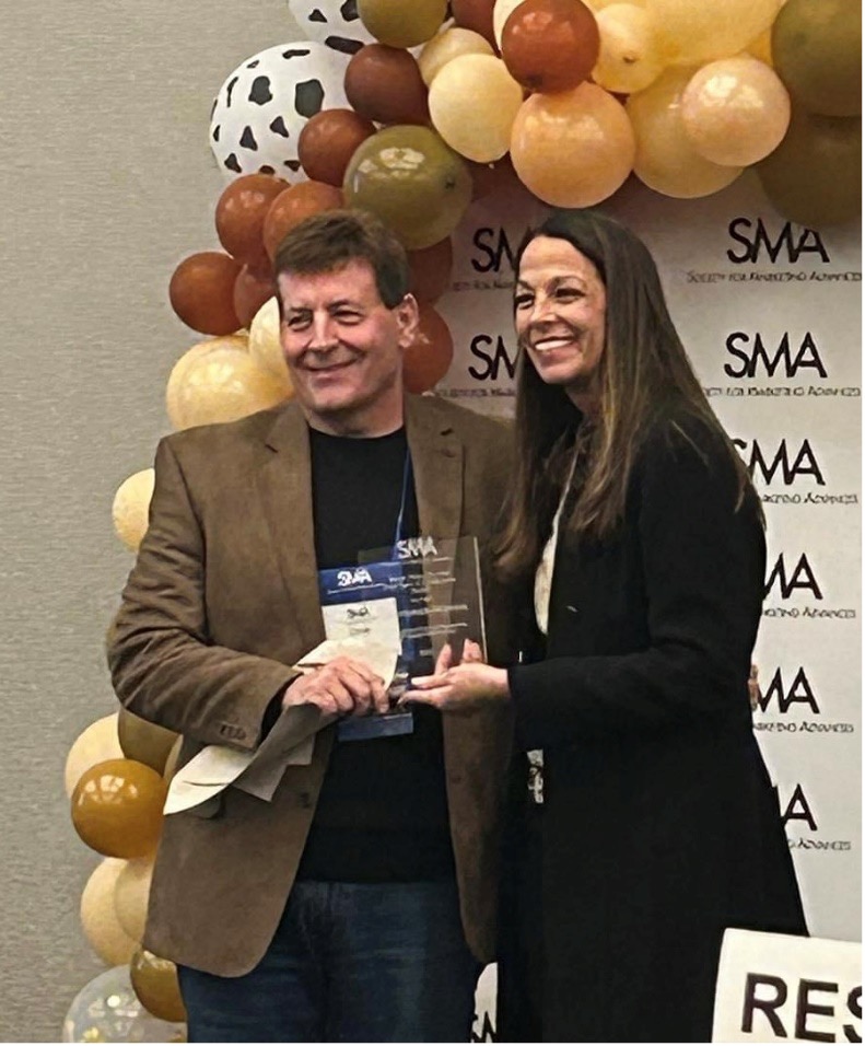 Chris Hopkins receiving award