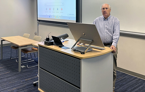 Jack Hopkins teaching in classroom