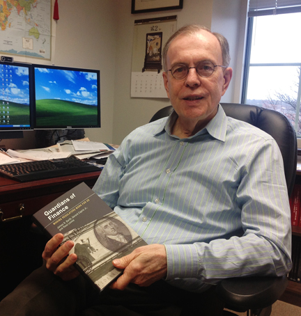 Jim Barth holding book