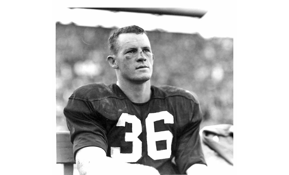 John McGeever football player sitting on sideline