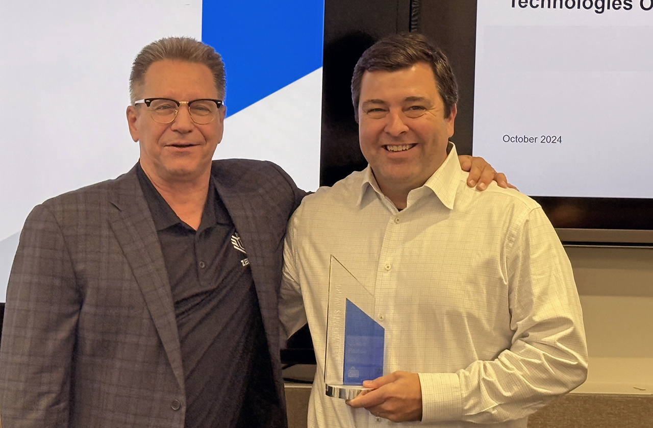 Two men standing next to each other