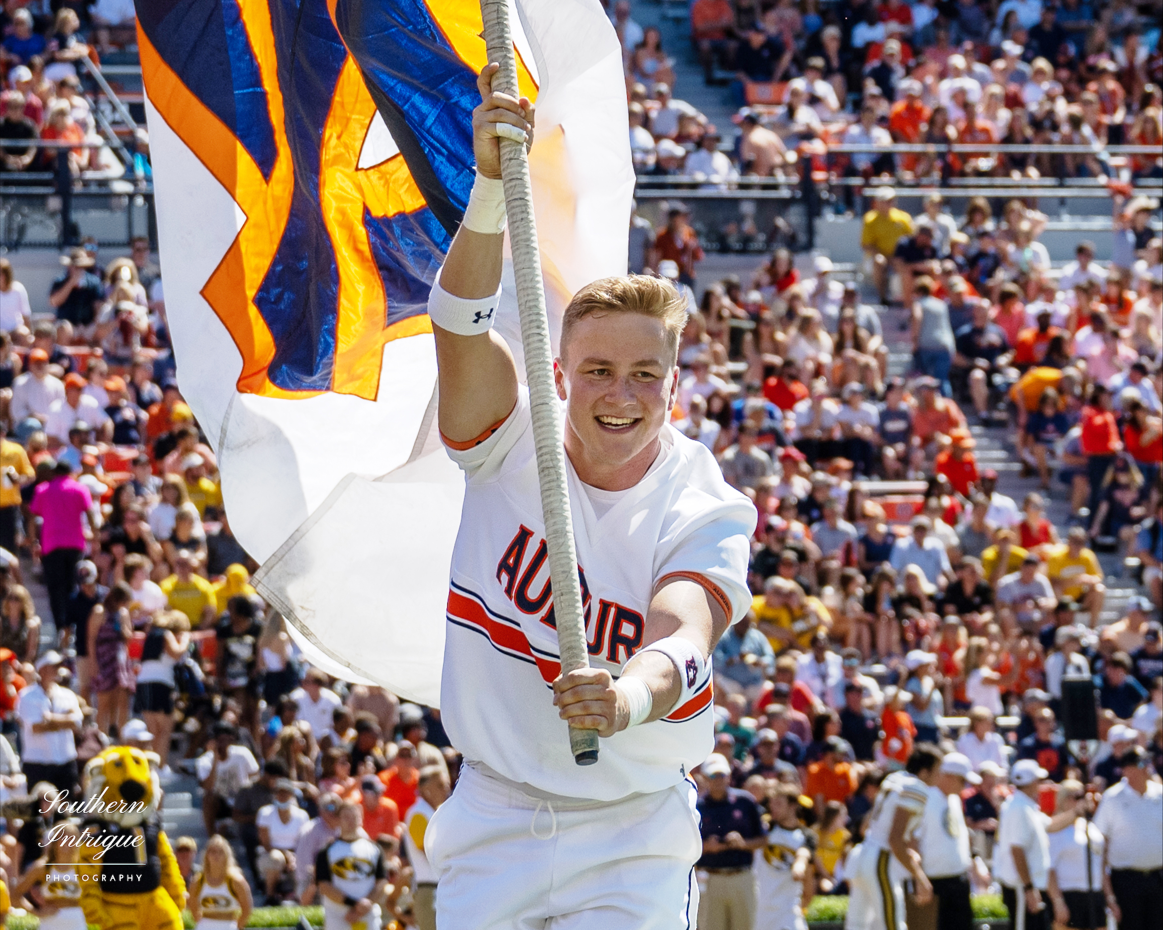 Luke Martin cheerleader with flag