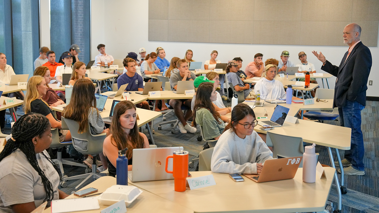 Man teaching college students