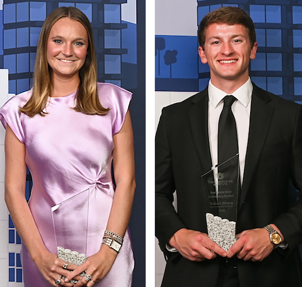 2 students standing with awards