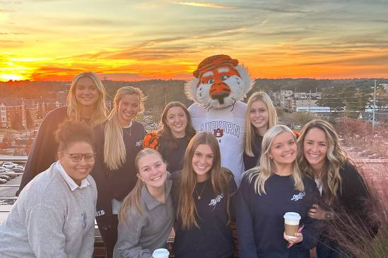 Women in Business with Aubie Women in Business officers with Aubie on HHH rooftop
