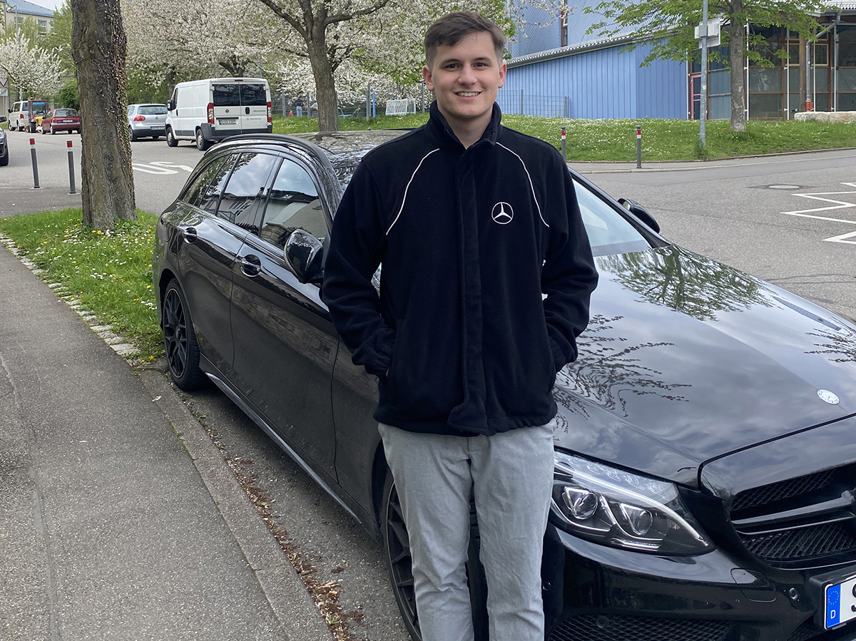 Will Humphries in front of Mercedes car
