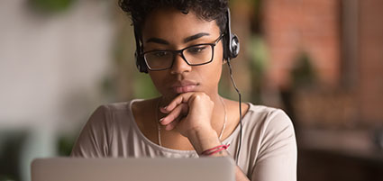 Student focused on computer