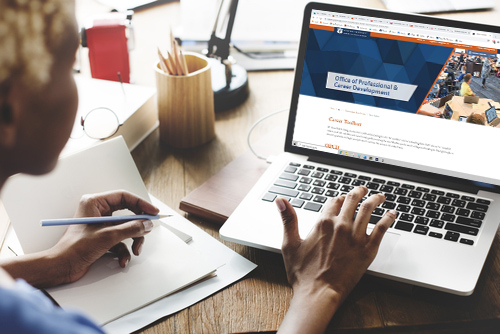 Woman accessing the career toolbox on her laptop