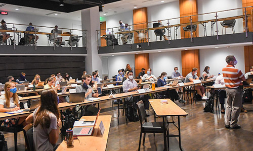 students attending a class at the Harbert College