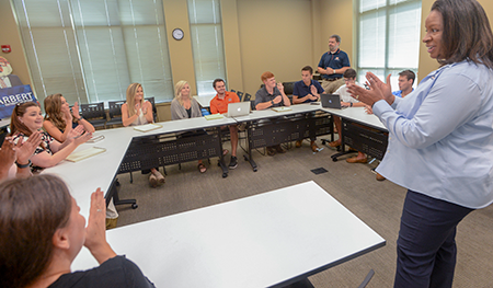 Dr. Baker and Scott McGlon mentoring Tiger Cage Students Harbert College of Business Complex
